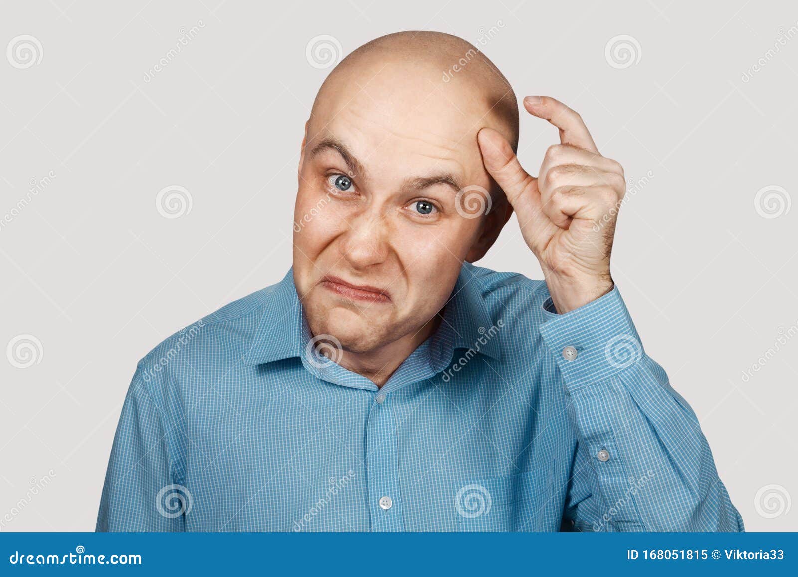 A Bald Guy Shows a Hand Gesture Meaning a Very Small Amount of Something  Stock Image - Image of bigness, person: 168051815