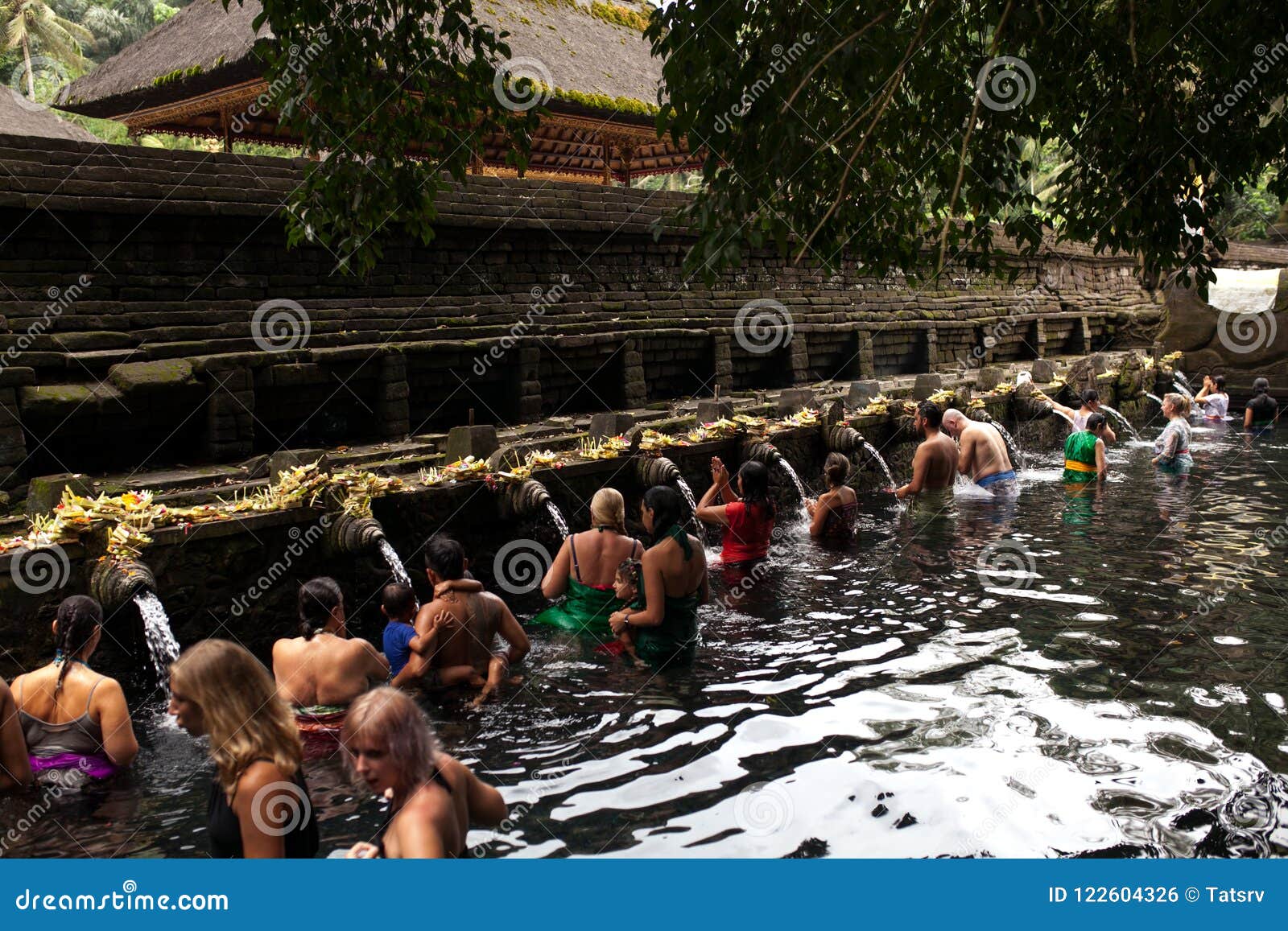 Balinese People Praying In Holy Spring Water Of Sacred Pool At Pura Tirta Empul Temple 