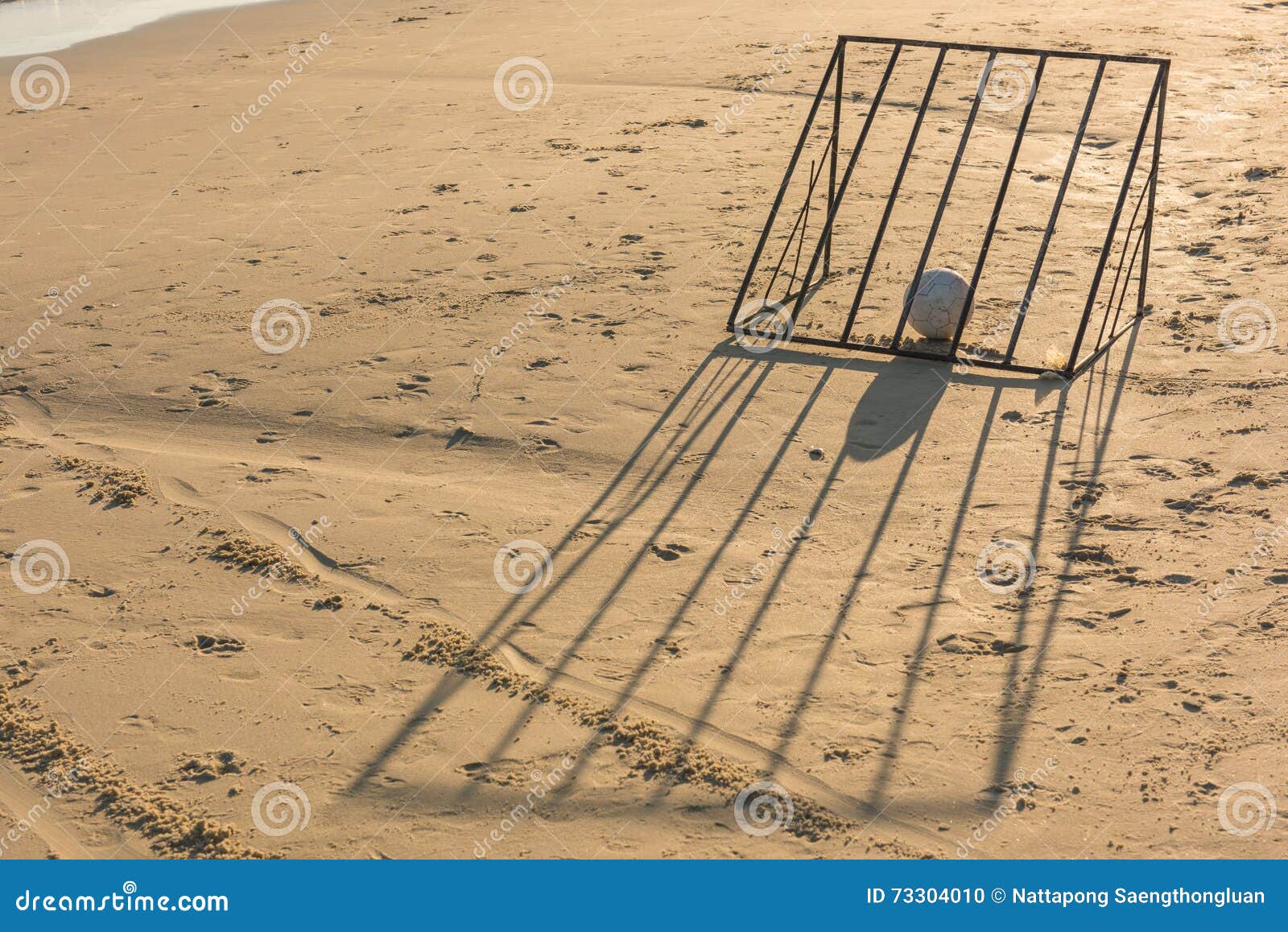 Ball with Beach Soccer Goal. Stock Photo Image of light, background