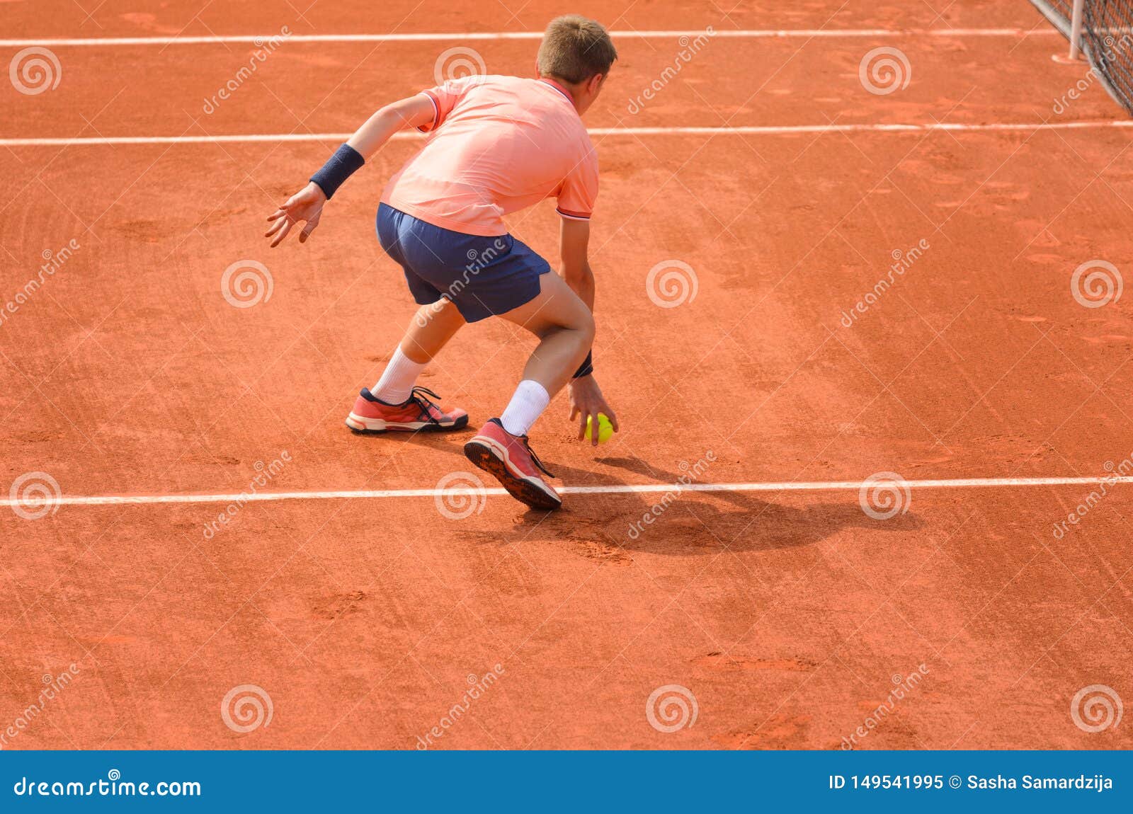 Ball Boy Picking Up The Ball On Tennis Court Editorial Image Image Of Equipment Game