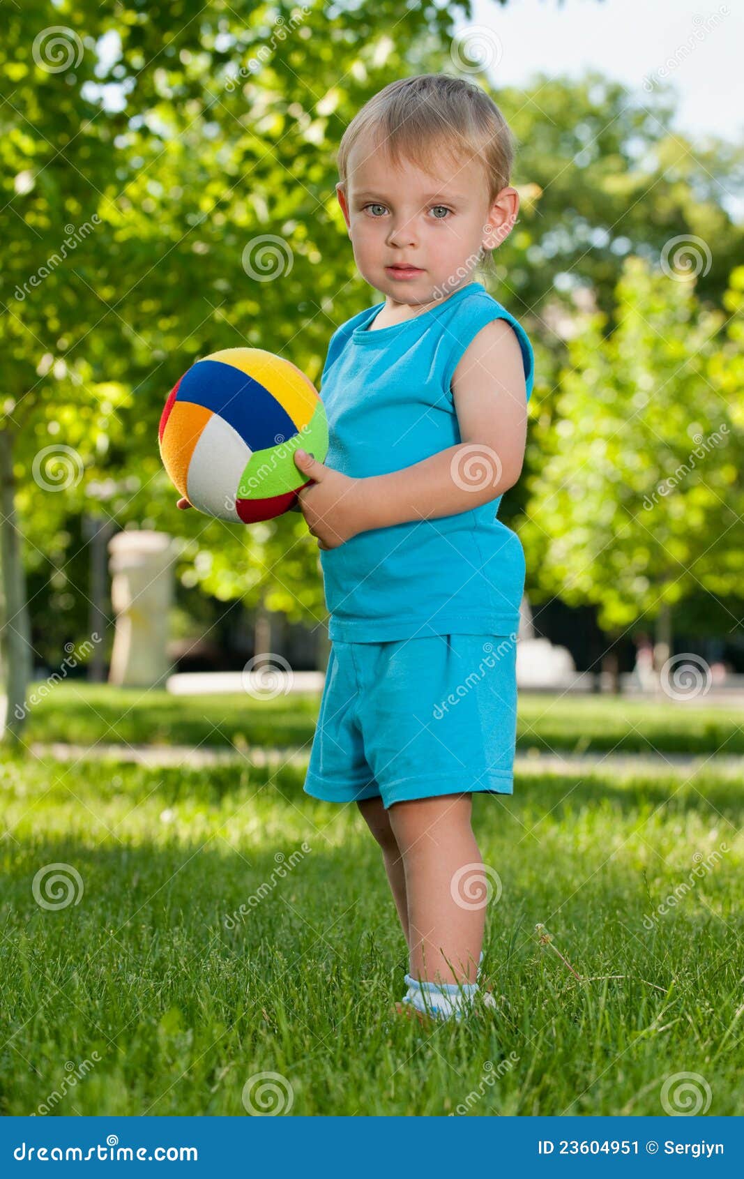With a ball in the park stock image. Image of standing 23604951