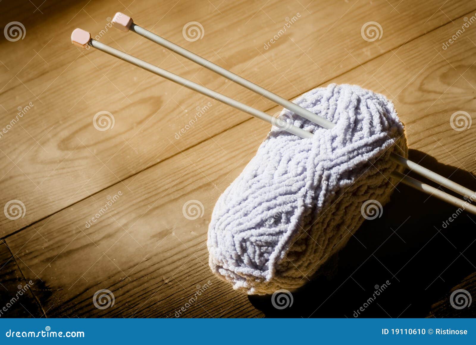 ball of wool and knitting needles