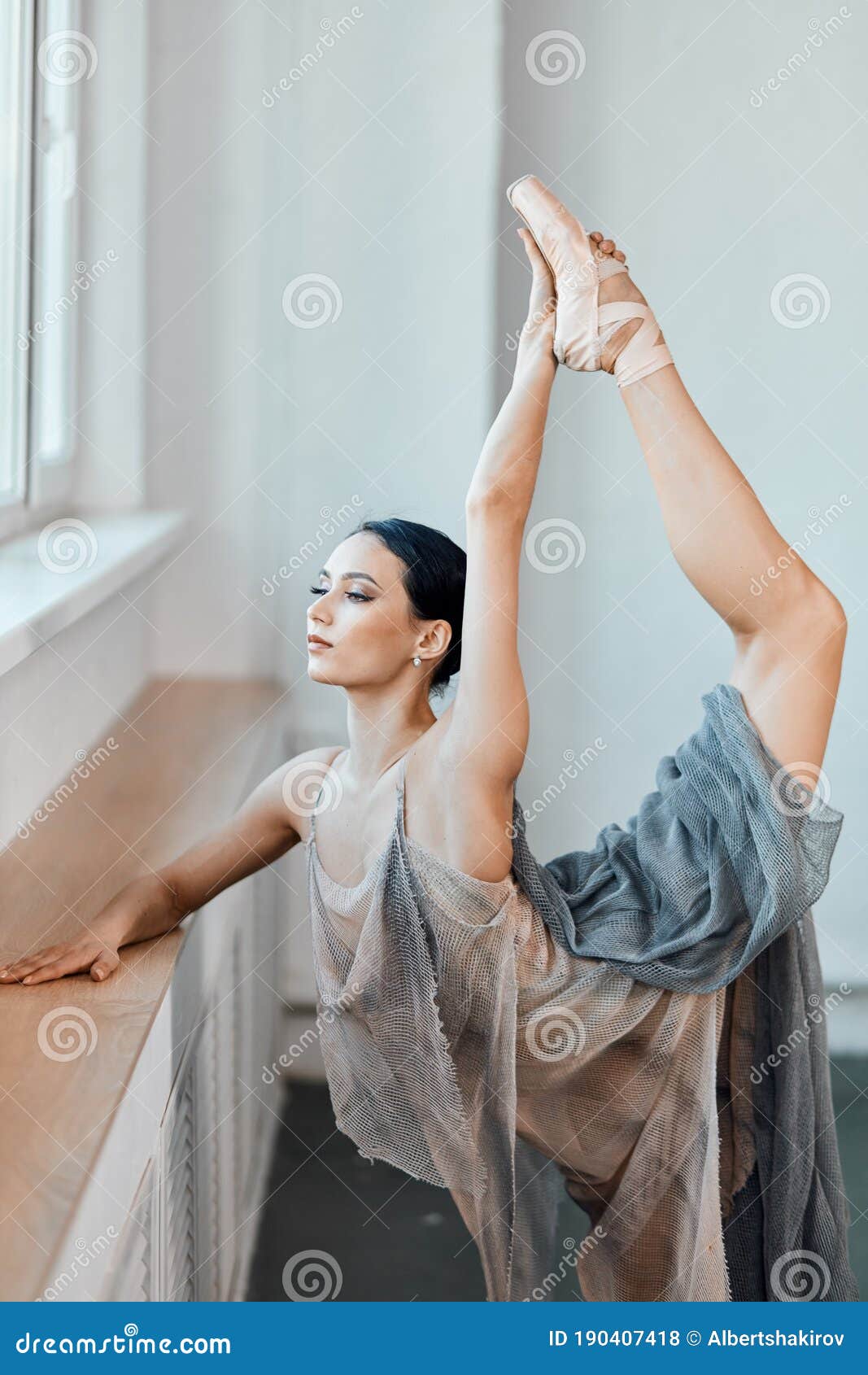 Ballerina Bends Back, Standing on One Leg Doing Stretching, Lifting Leg ...