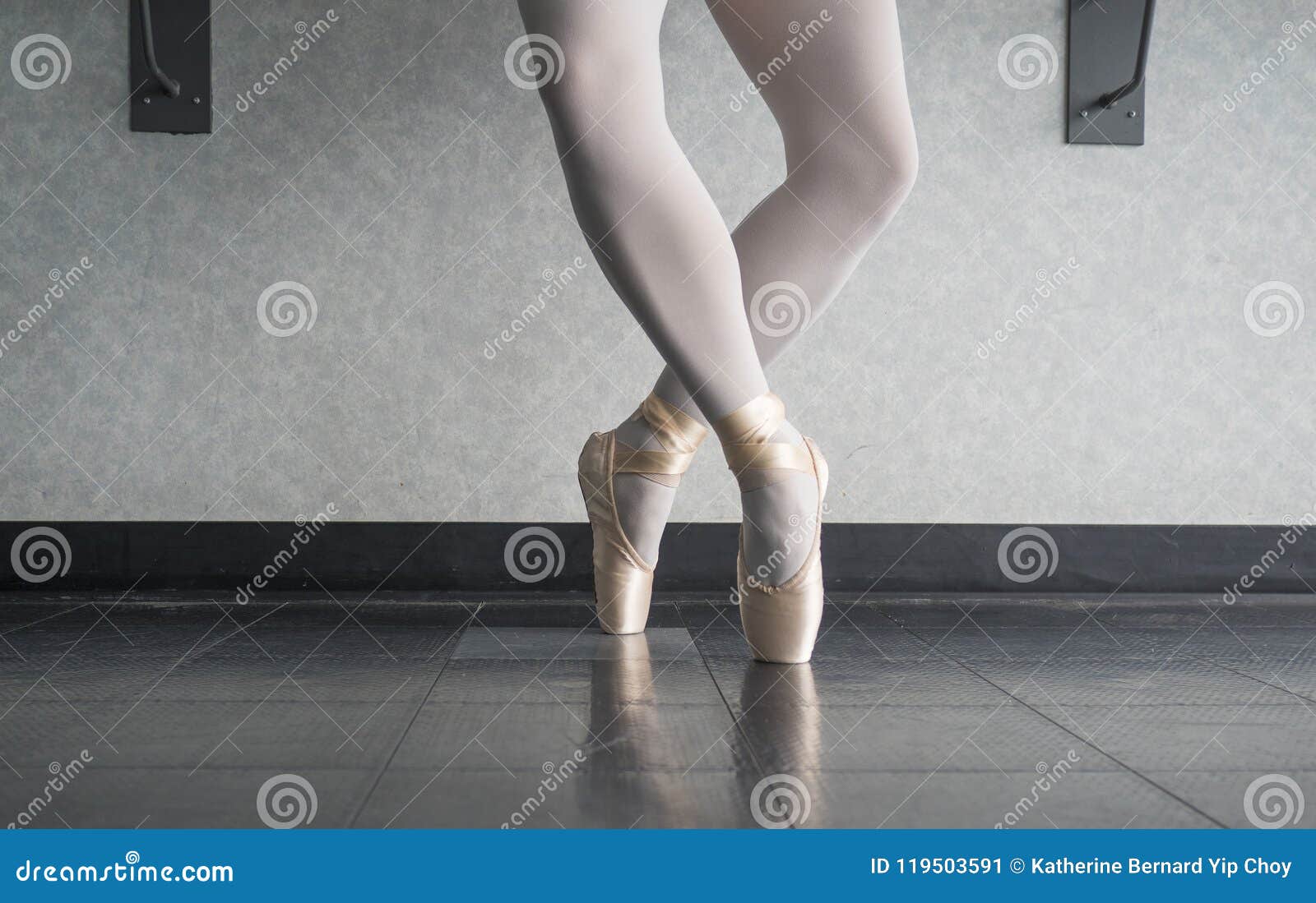 ballerina dancer in the ballet studio en pointe in releve fourth position