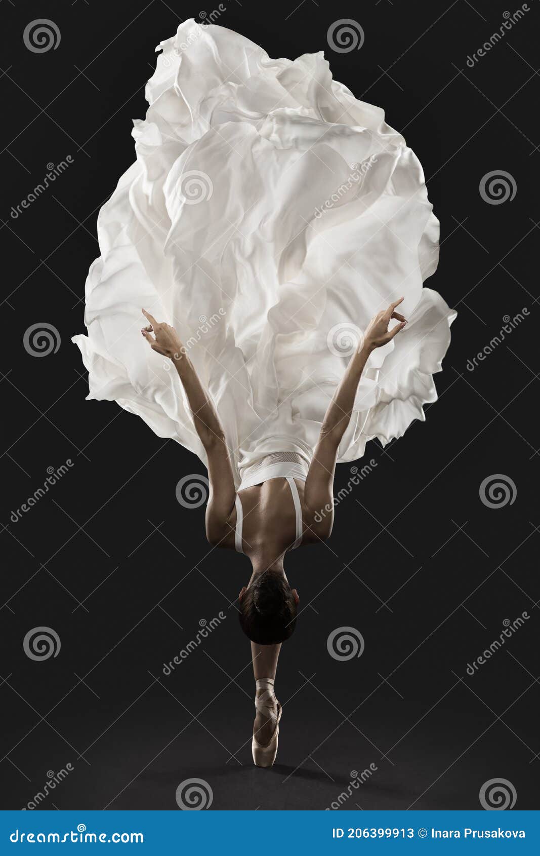 ballerina graceful jump in white silk dress, ballet dancer pointe shoes in fluttering cloth