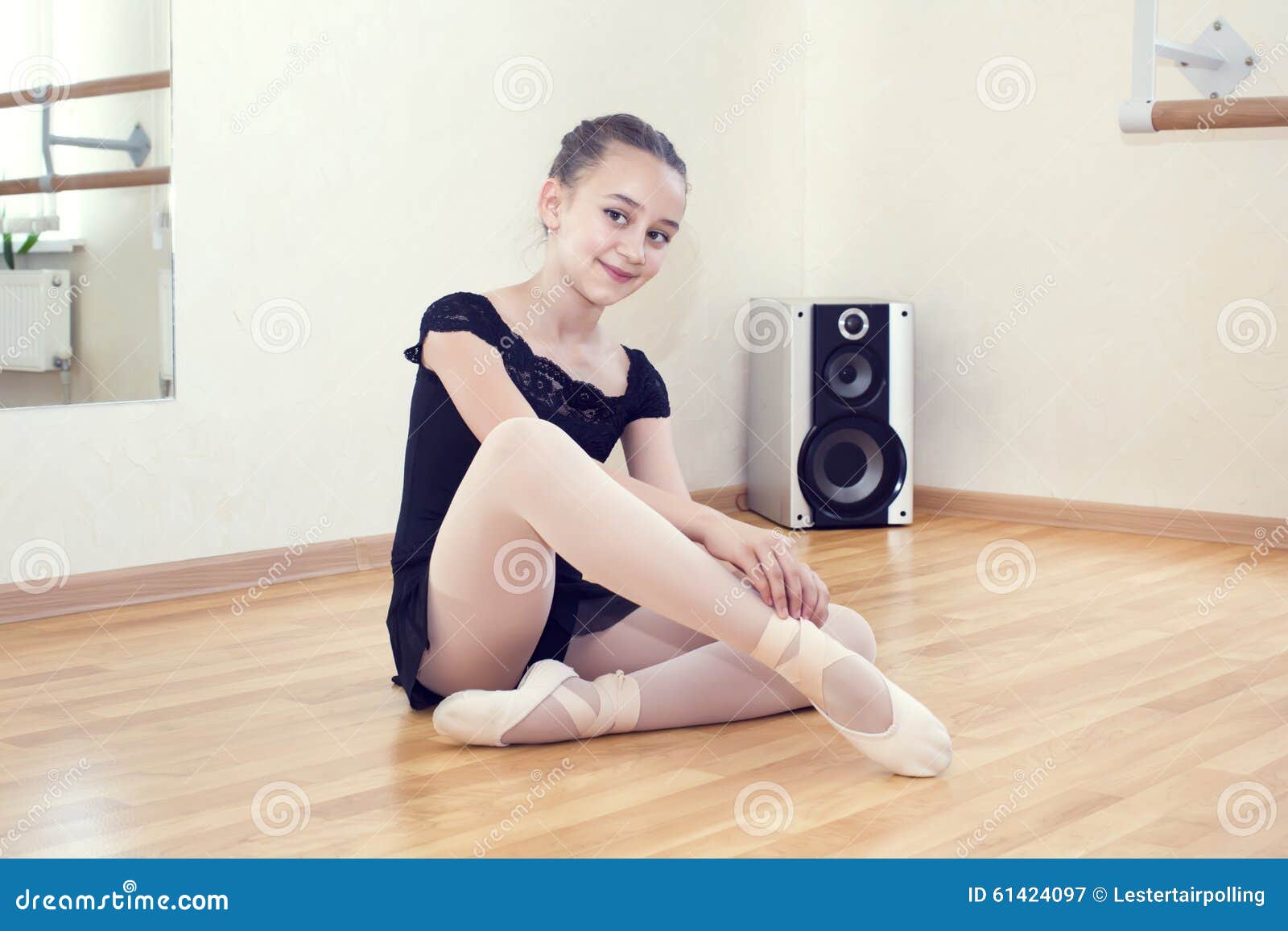 A little girl dressed as a ballerina in ballet
