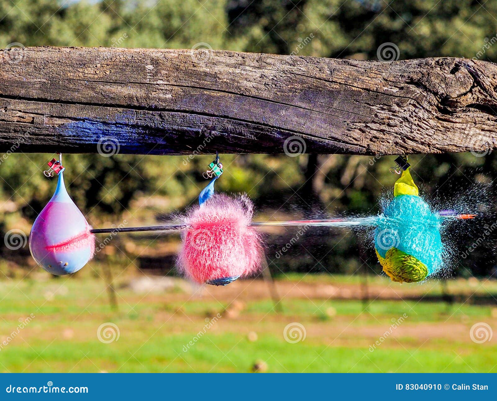 Balloons Exploding when Hit by an Arrow. Closeup Hispeed Shot Stock