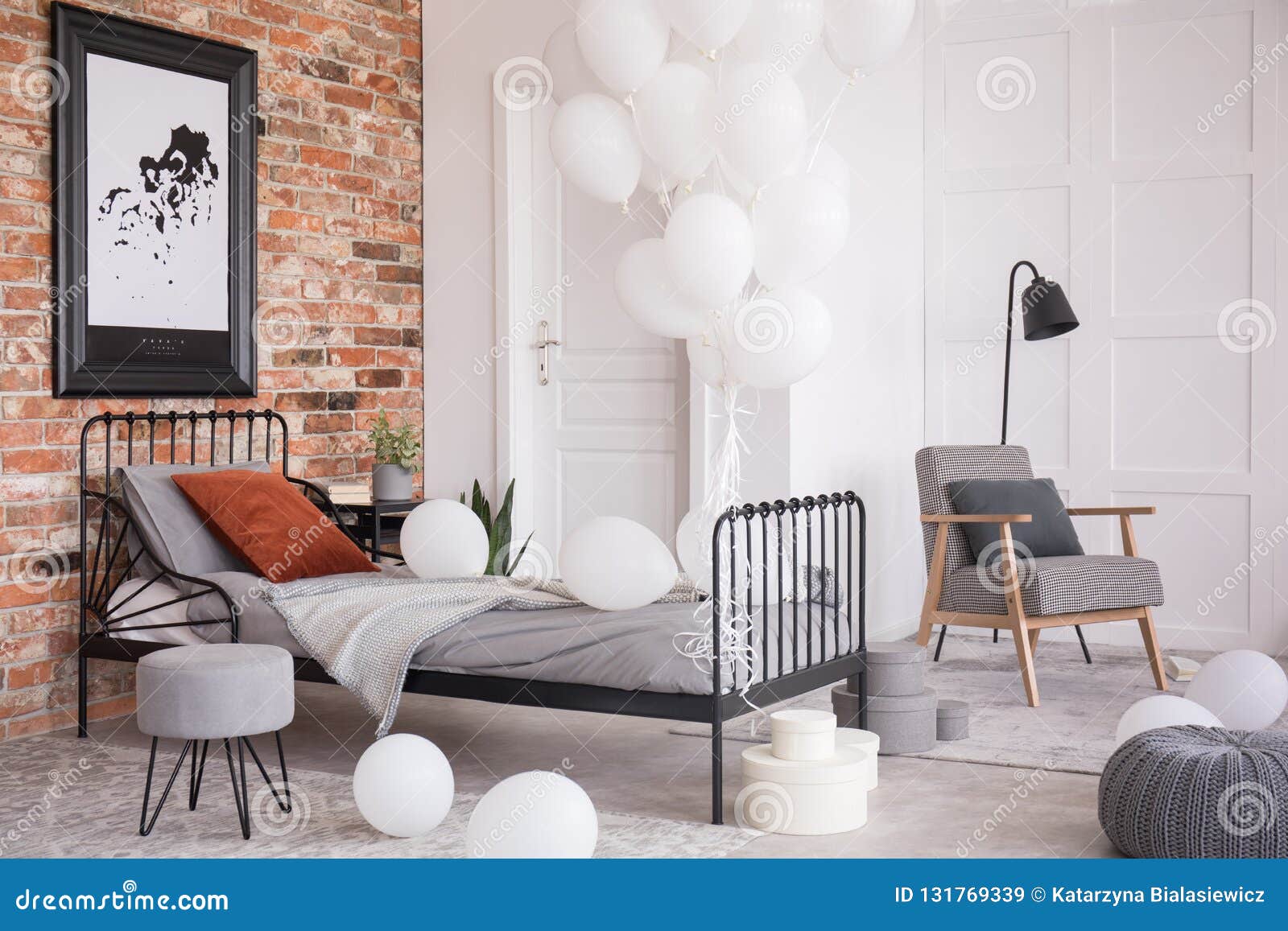 balloons in industrial stylish bedroom, real photo with copy space