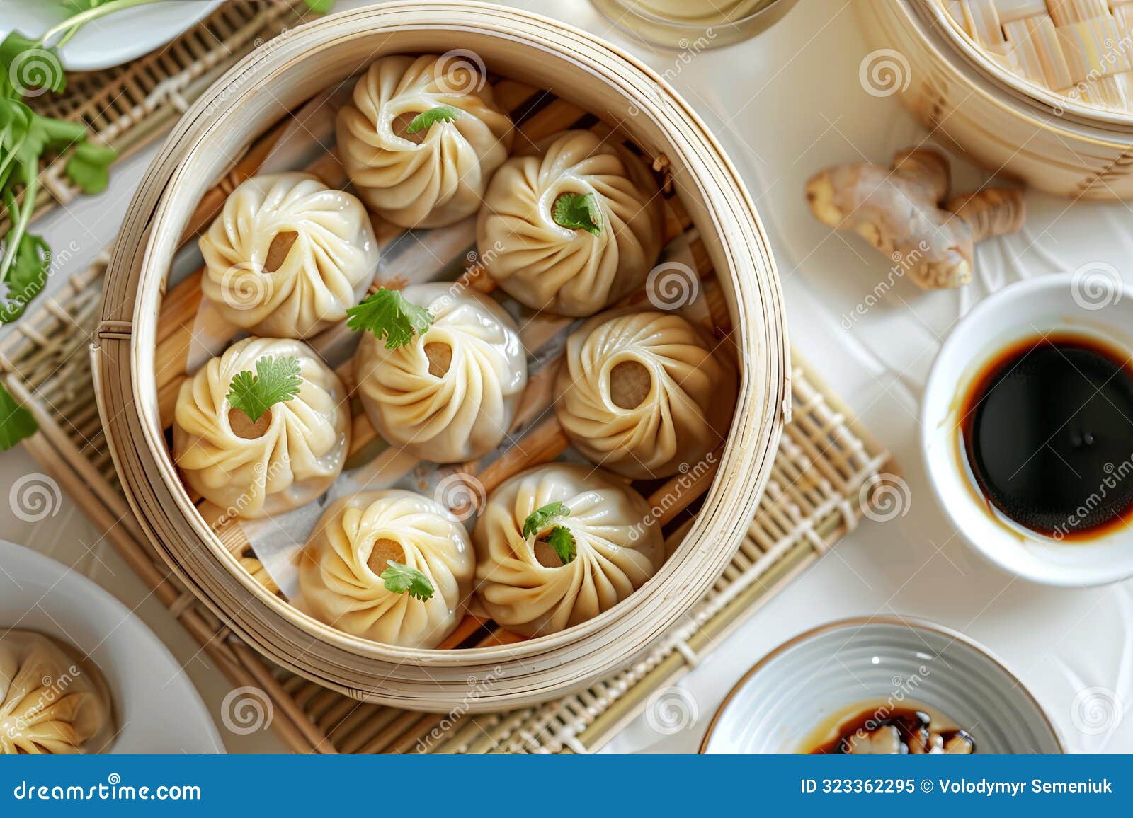 steamed xiao long bao soup dumplings served in bamboo basket