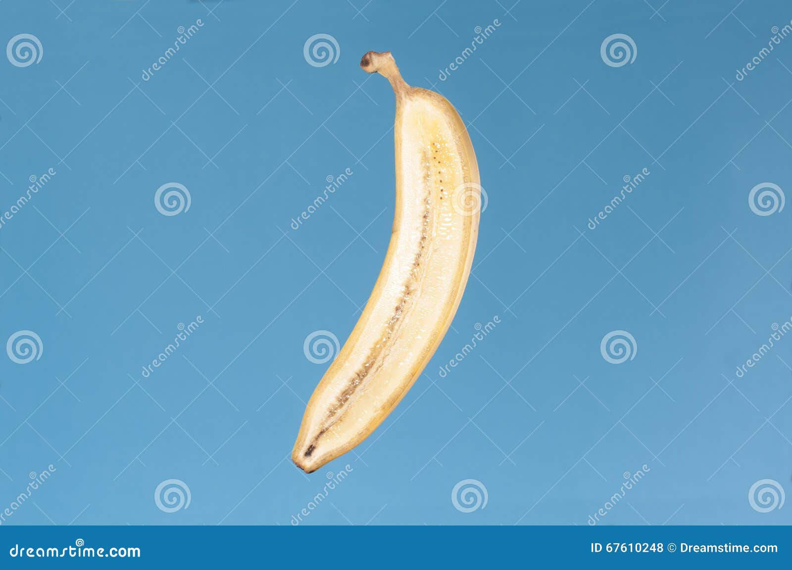 Banana cut in half stock photo. Image of blue, lighting 67610248
