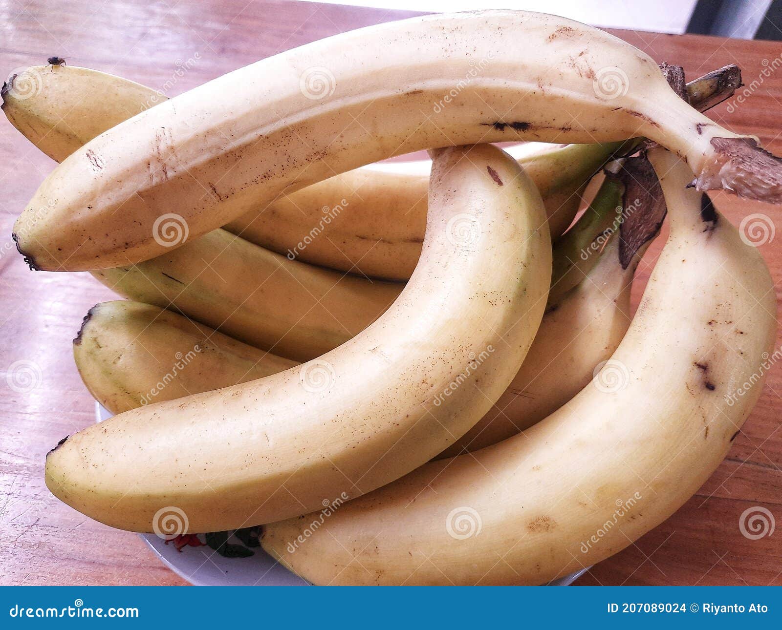 A Pile of Bananas on the Table Stock Photo Image of carving, crop