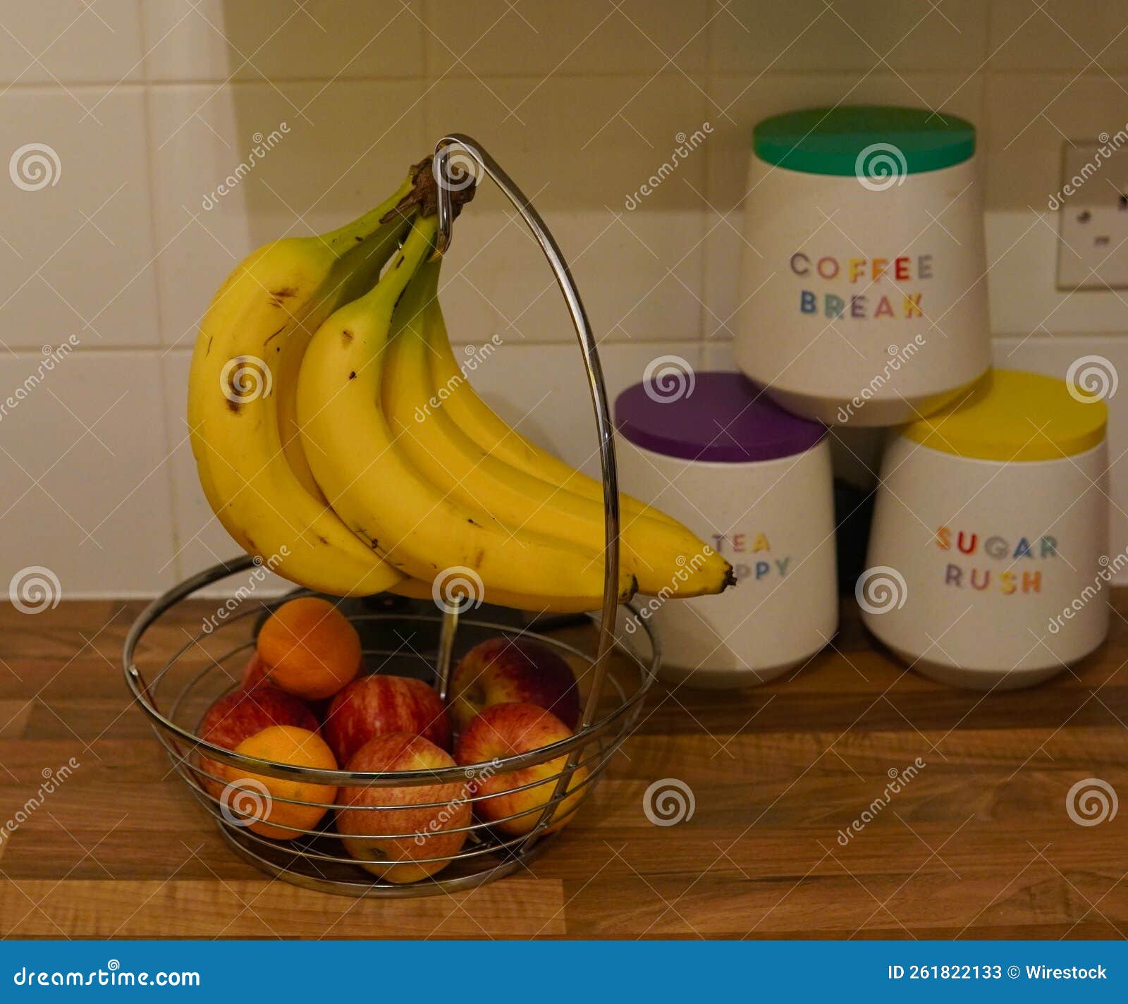 Banana Holder with a Peach Basket and Ceramic Jars in the Kitchen Stock Image Image of home