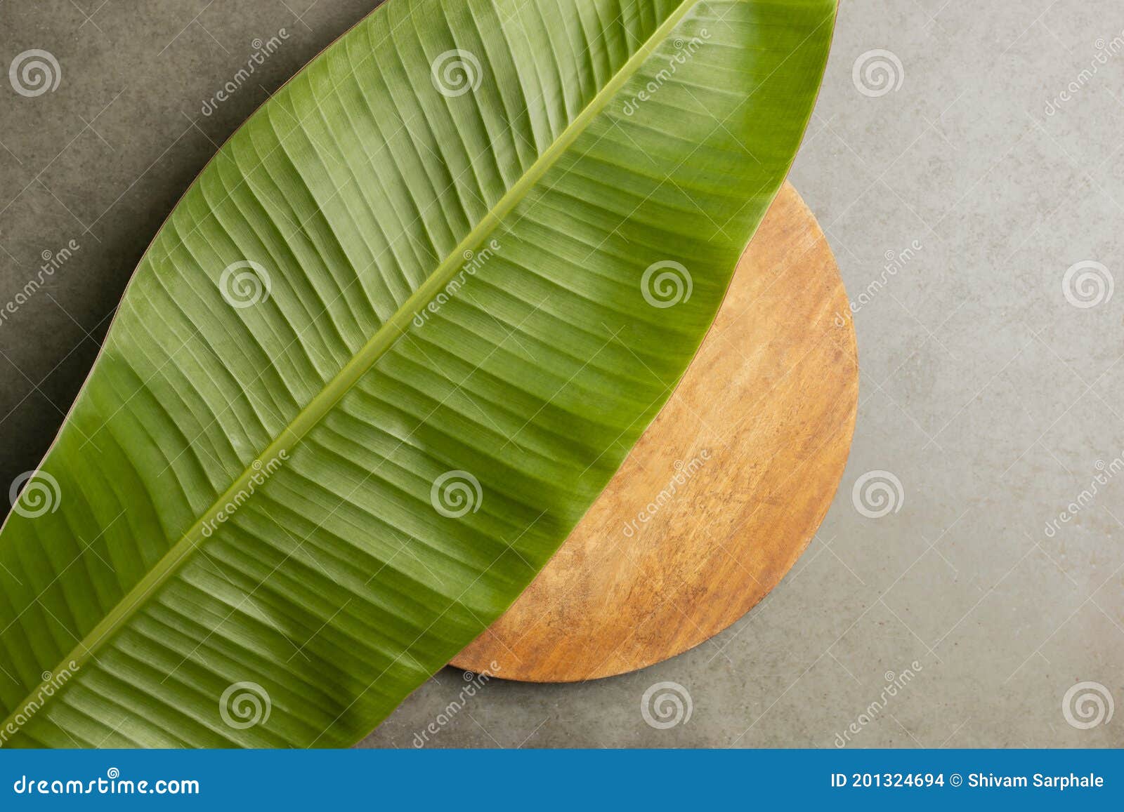 Banana Leaf Background , Banana Leaf and Wooden Circular Base on Marble