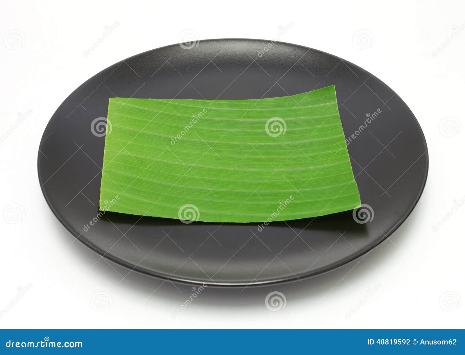Banana leaf on blank plate stock photo. Image of table 40819592