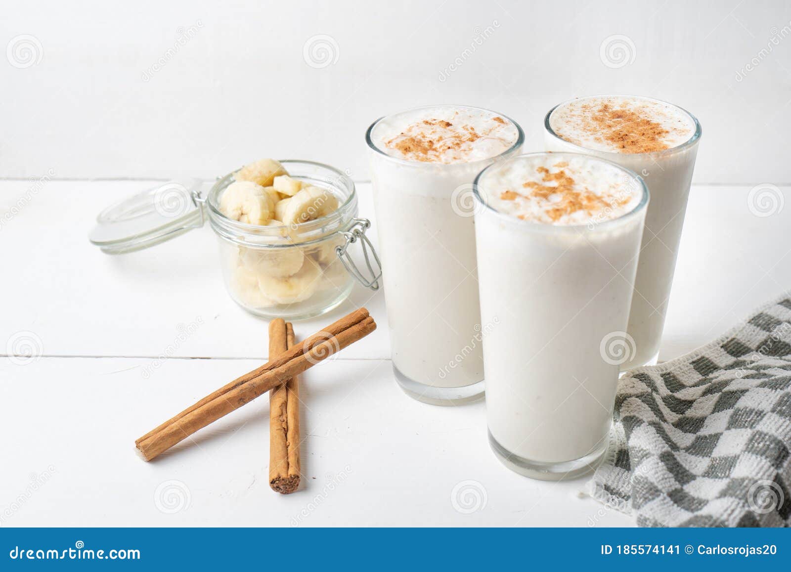 banana smothie or milkshake with cinnamon on white  background