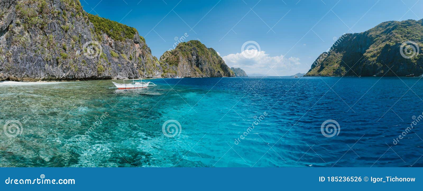 banca boat moored near limestone rocks of matinloc island, highlights of hopping trip tour c. most beautiful place at marine