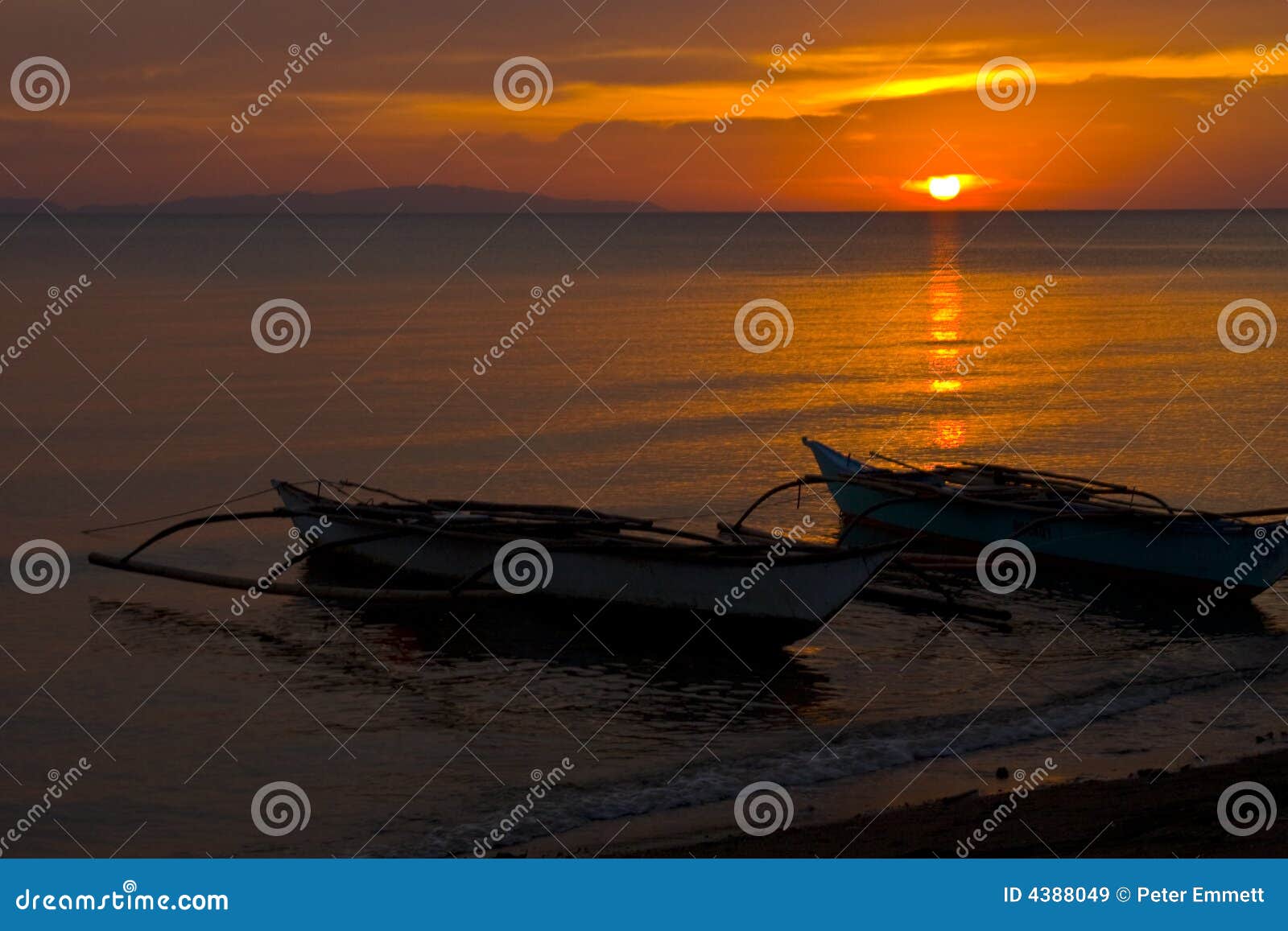 banca boats at sunset on beach