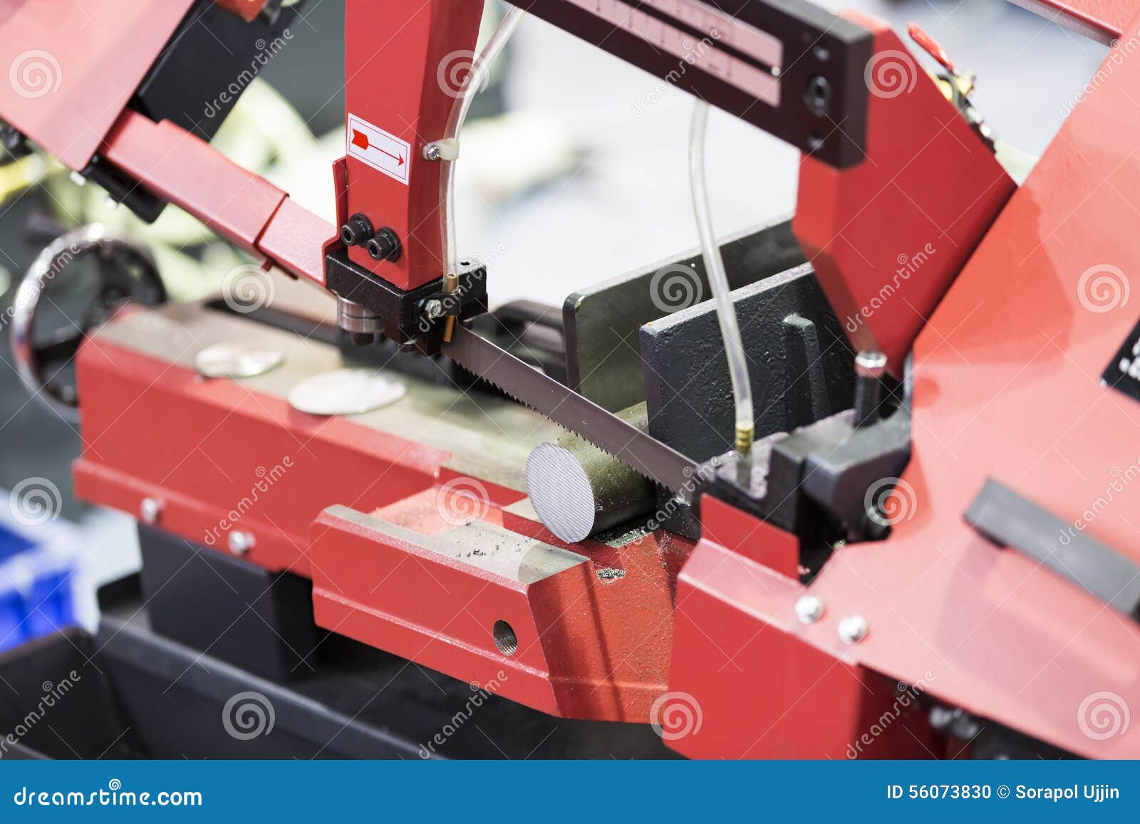 Band saw cutting steel bar stock photo. Image of process 56073830