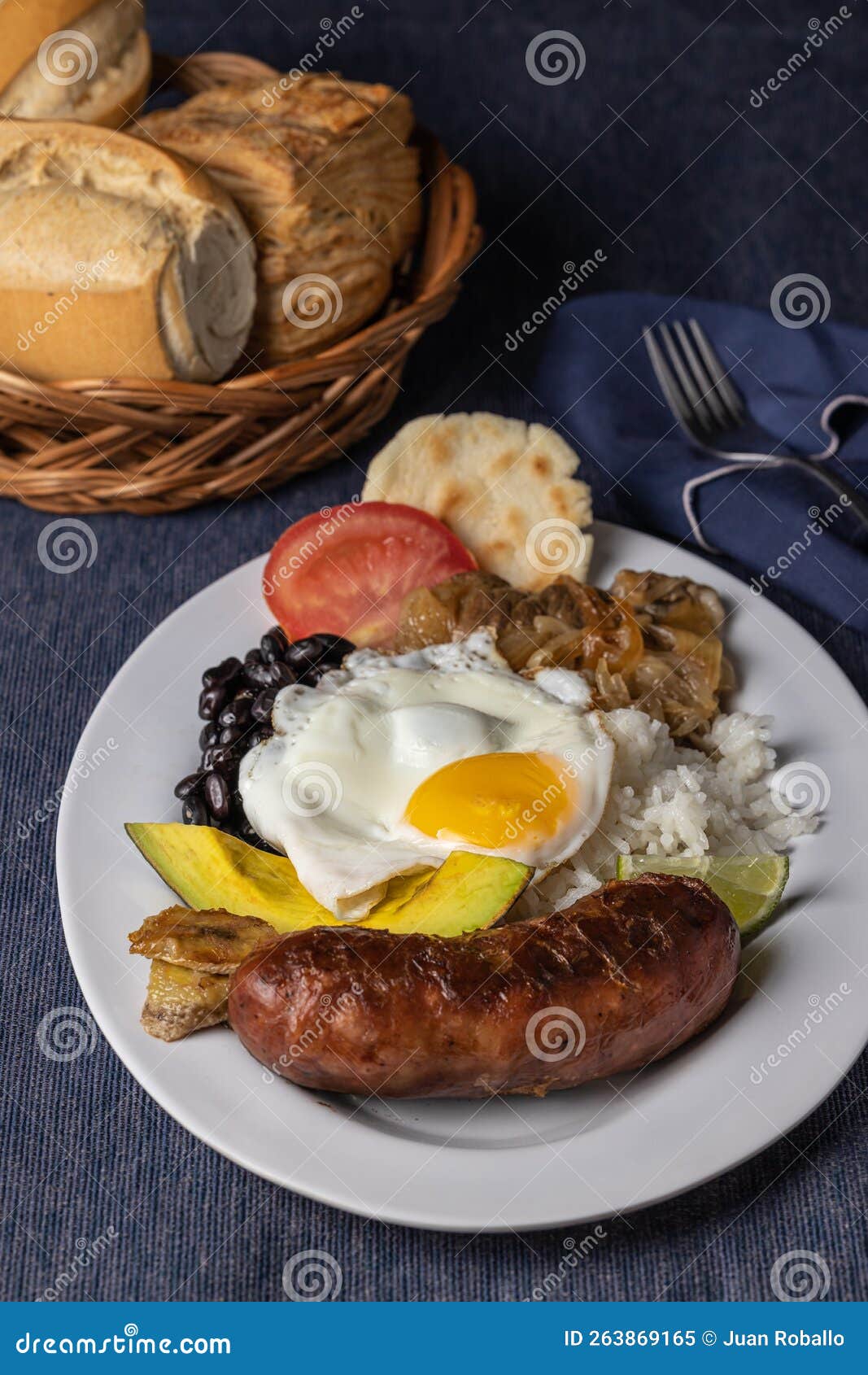 bandeja paisa, typical food of colombia with beans, rice, eggs and pork