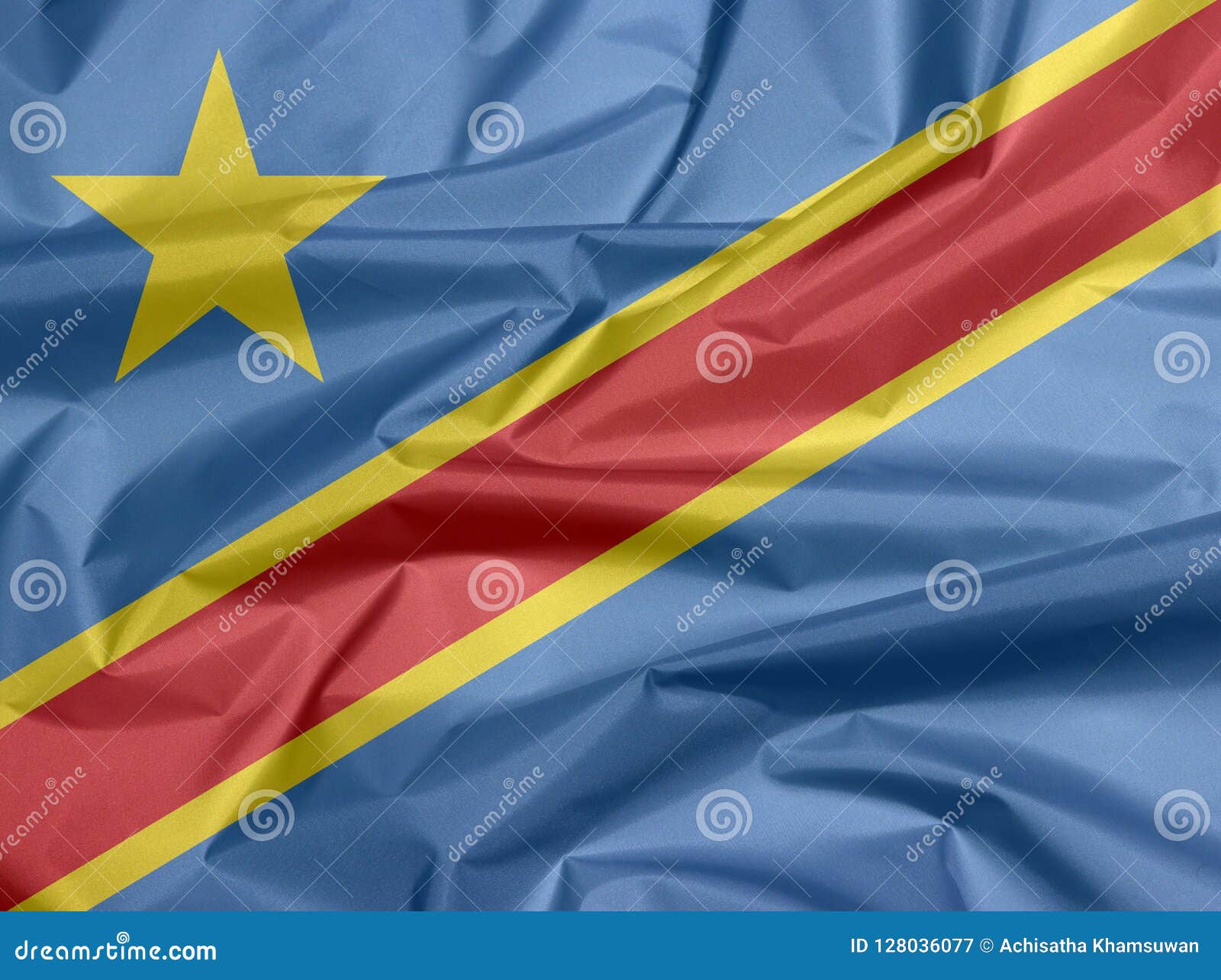 Bandera de la tela del Dr. Congo Pliegue del fondo de la bandera del Dr. Congo, campo del azul de cielo con la raya y la estrella diagonalmente rojas y amarillas