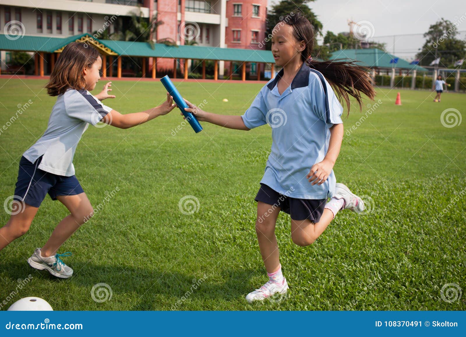 In A College In Bangkok, School Children In Outdoor Sports Court ...