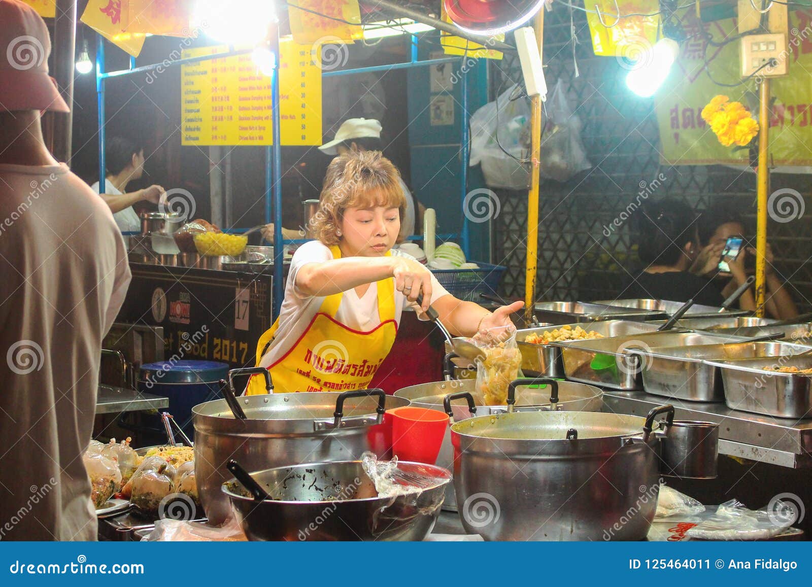 BANGKOK, THAILAND - October 2017: Pretty Thai Woman Cooking Food in