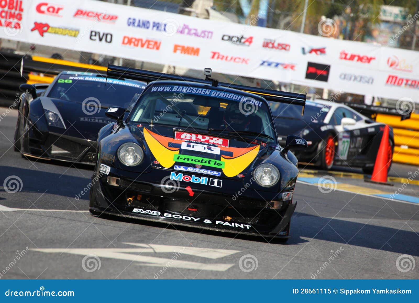 BANGSAEN, THAILAND - DEC. 22 : Vutthikorn I. driver of porsche no.18 in super car Thailand compitition during the Bangsaen Thailand Speed Festival 2012 on December 22, 2012 in Bangsaen Thailand.