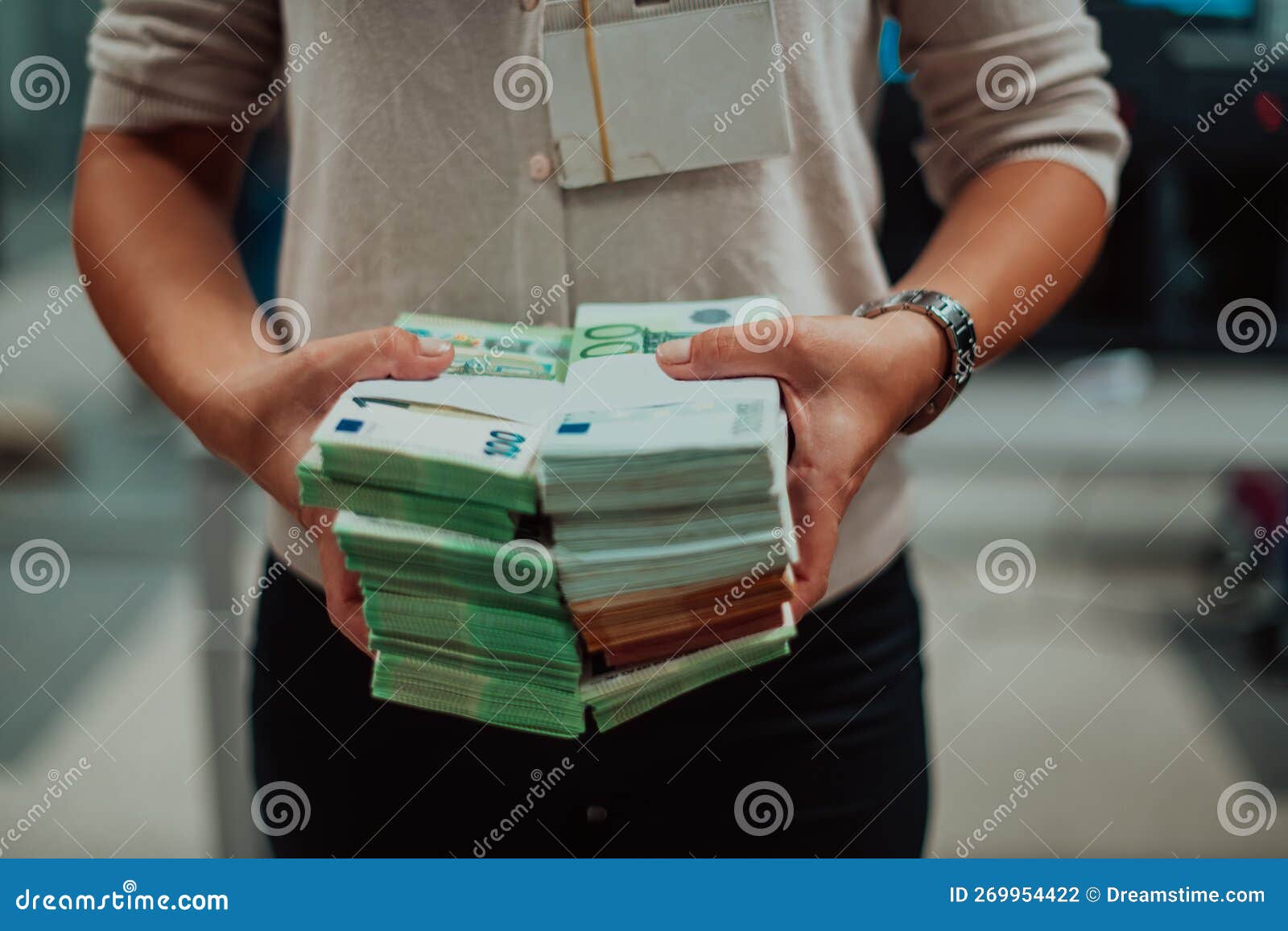 Bank Employees Using Money Counting Machine while Sorting and Counting