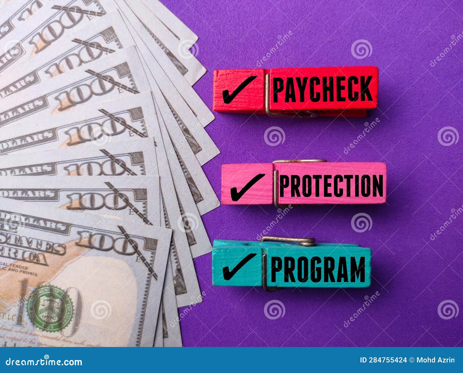 Banknotes with the Word PAYCHECK PROTECTION PROGRAM Stock Photo Image