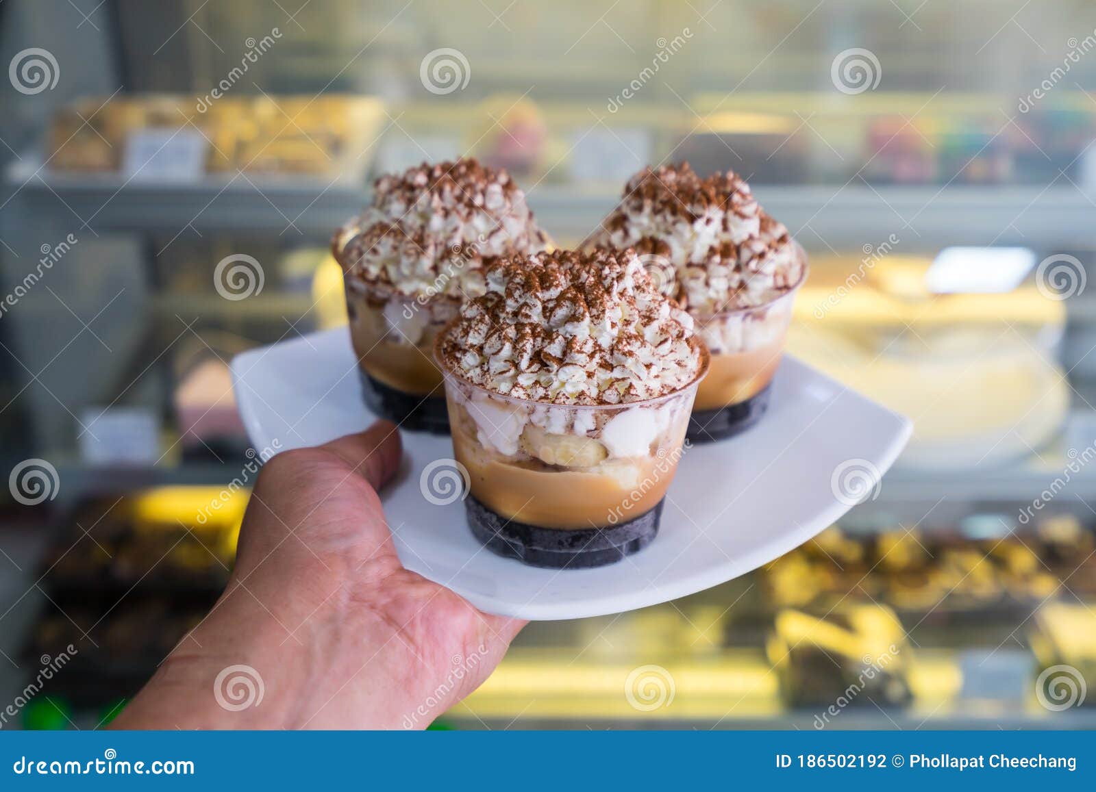 Banoffee Cake Cup on Hand in Shop Stock Photo Image of cake, slice