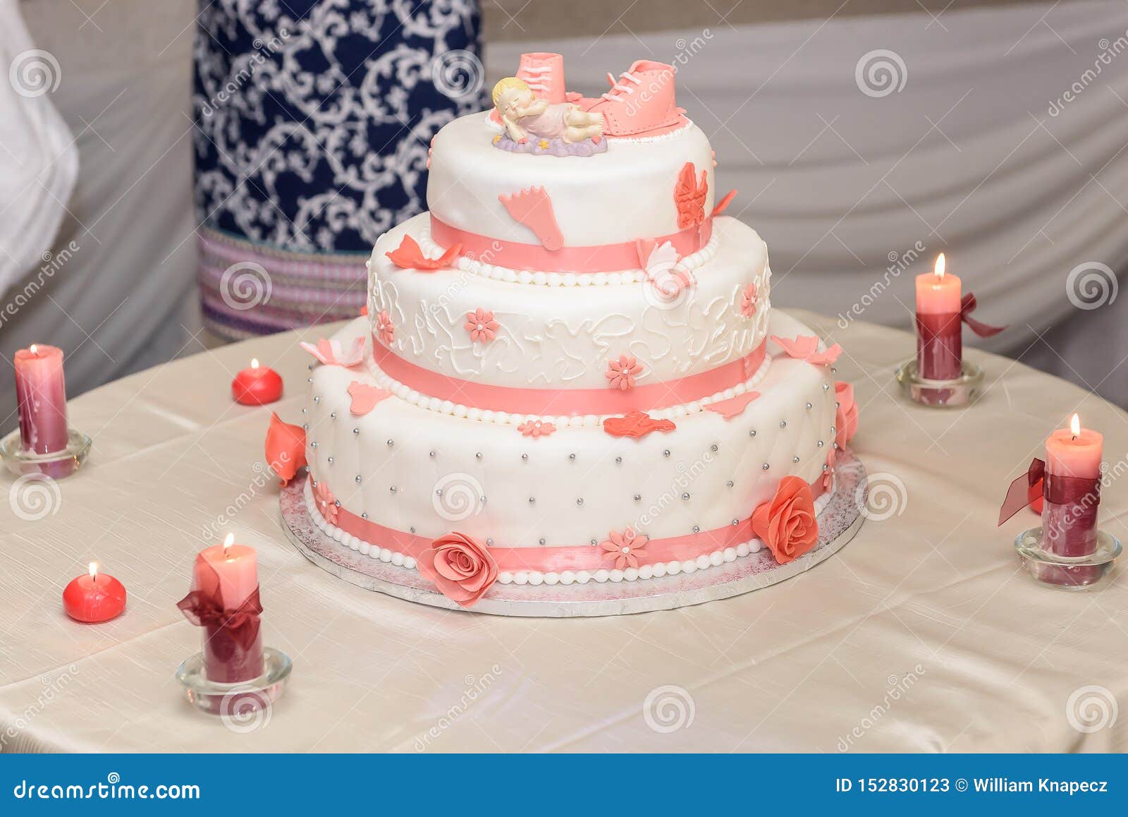 baptize cake with sugar shoes and burning candles