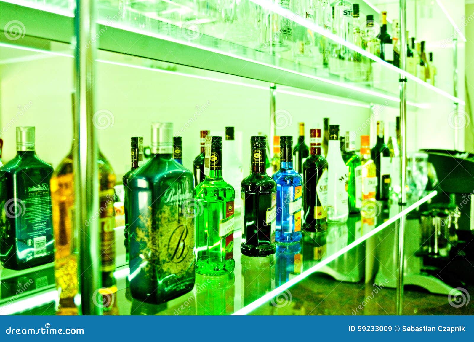 Bar bottles in green editorial stock image. Image of drink 59233009