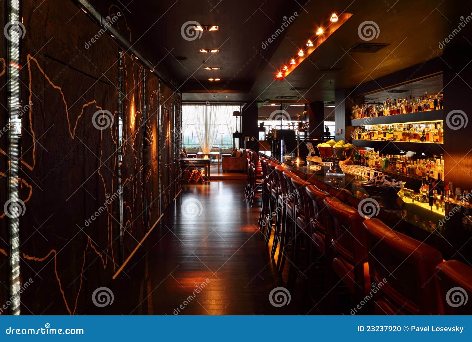 bar counter with tall chairs in empty restaurant