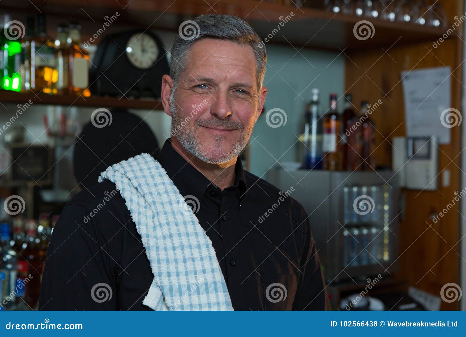 Bar Tender Standing Counter Portrait 102566438 