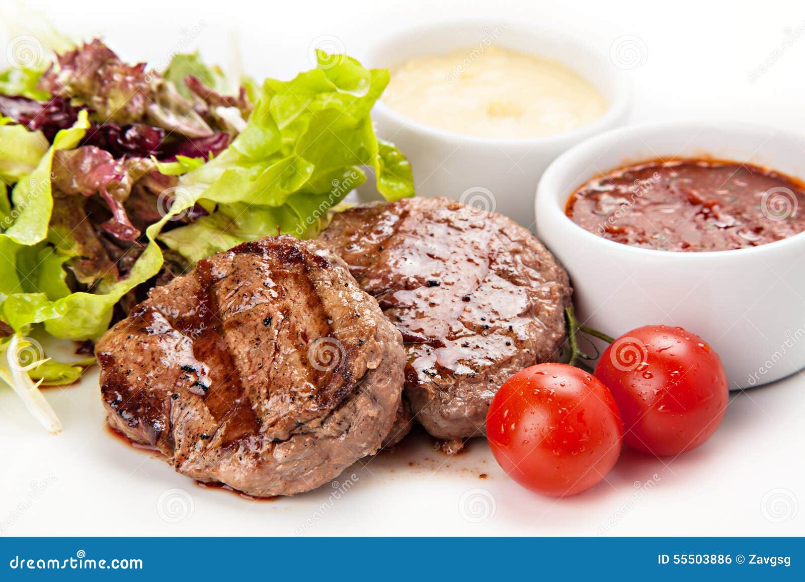Barbecue Beef Steaks Medium Grilled with White and Red Sauces Stock