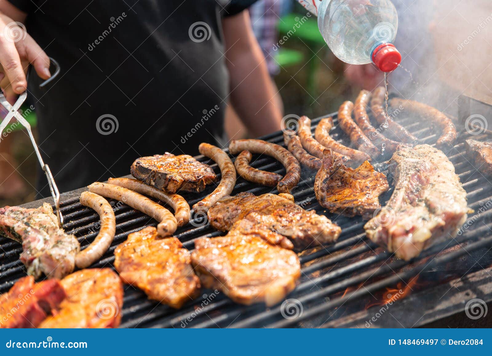 Barbecue, Process of Cooking Meat. Rest on Weekends. Friends on Picnic