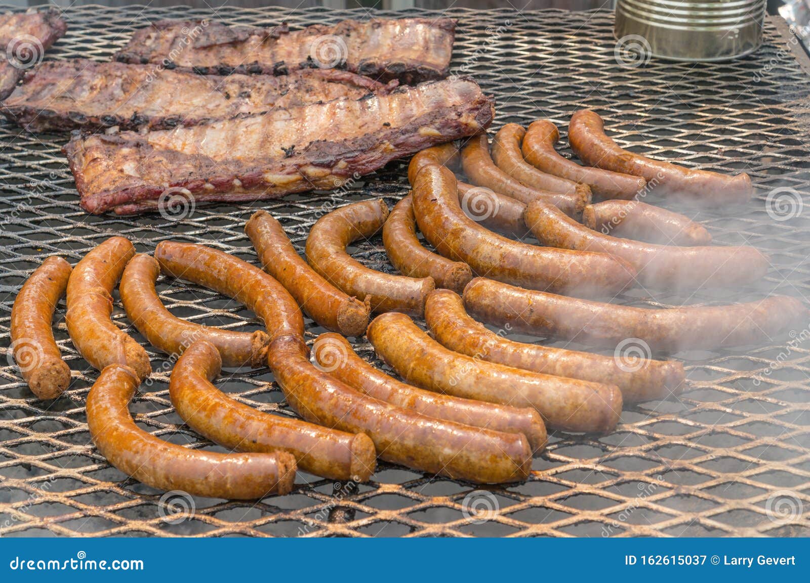 Barbecue with Ribs and Sausage Stock Image Image of dinner, flames