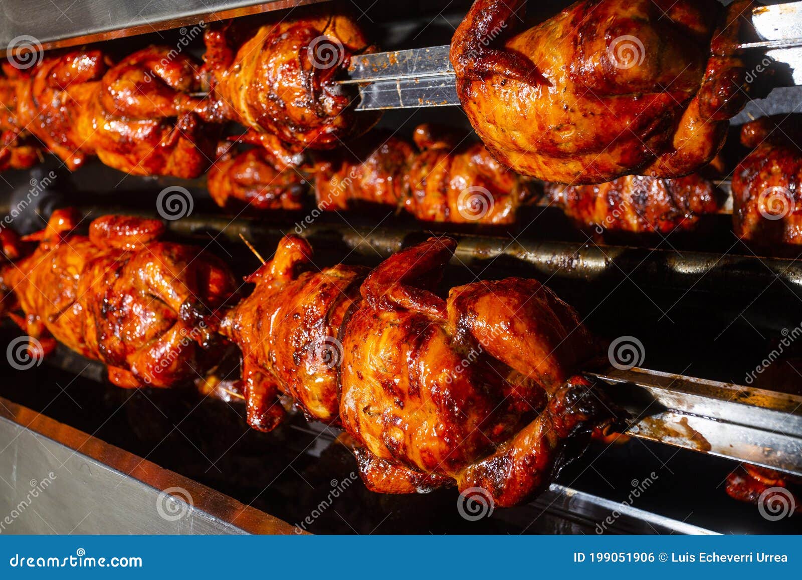 Barbecue Roast Chicken in a Row Turning at Industrial Roaster Stock