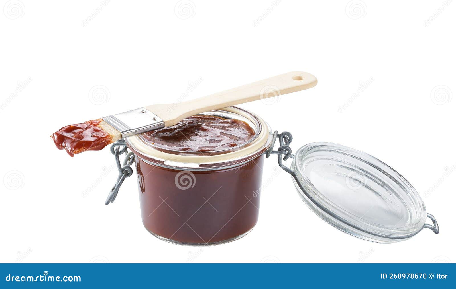 Barbecue Sauce in a Jar with Barbecue Brush Isolated on a White
