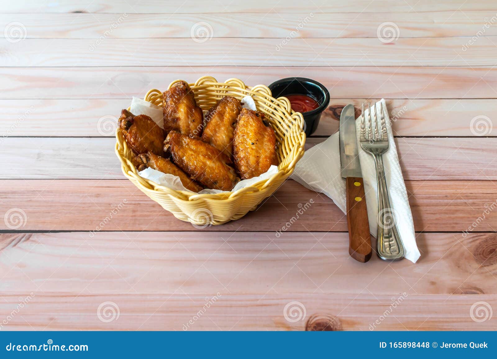 Barbecued Chicken Wings in a Basket with Empty Copy Space of Text Stock