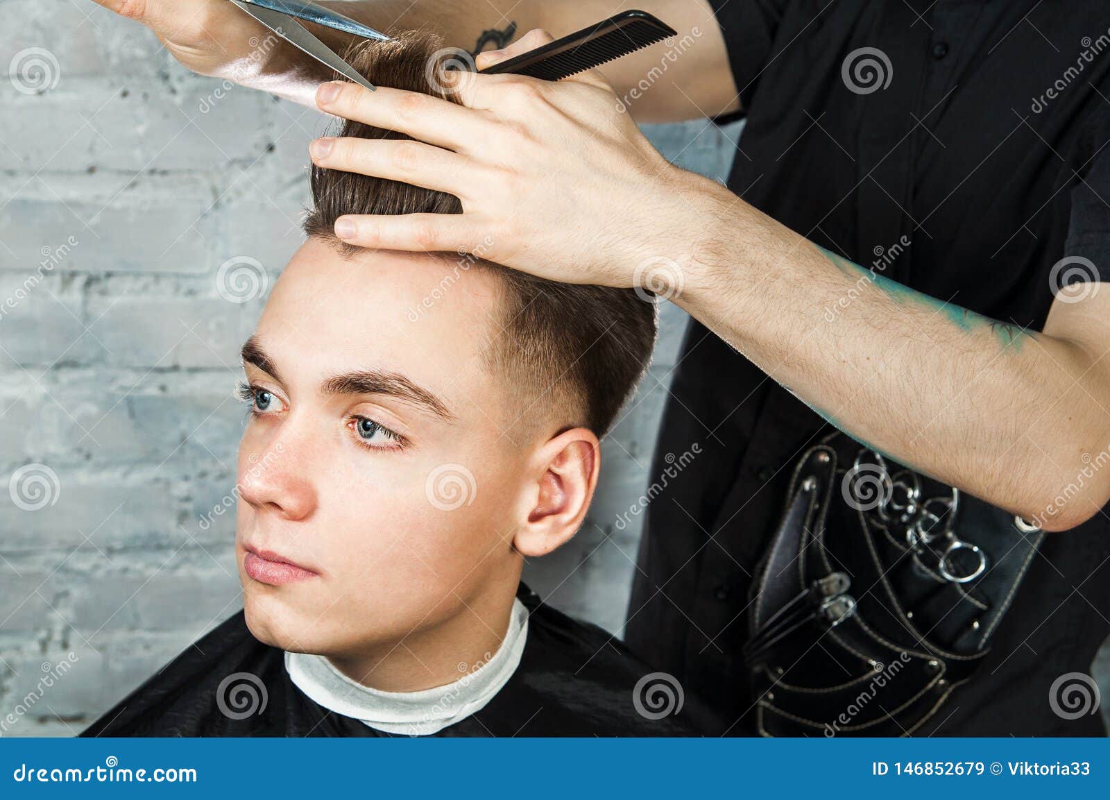 Barber Hair Styling of Young Guy in the Barbershop on Brick Wall  Background, Hairdresser Makes Hairstyle for a Young Man. Stock Image -  Image of barbershop, clippers: 146852679