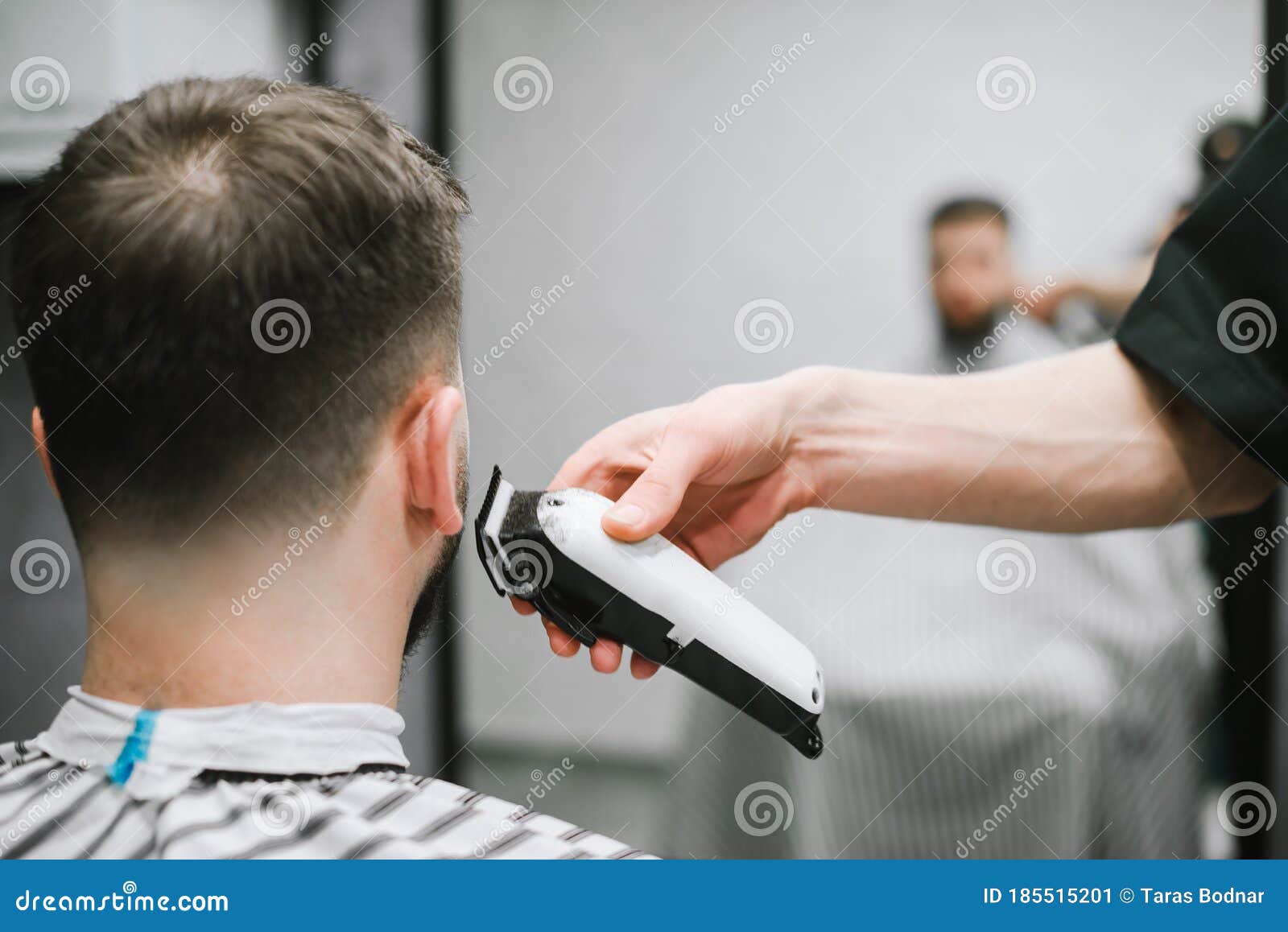 Barber`s Hand with a Clipper Cuts the Back of a Man`s Neck. Haircuts in  Barbershop. Hairdresser Shaves a Young Man Hair Clipper Stock Image - Image  of background, clipper: 185515201