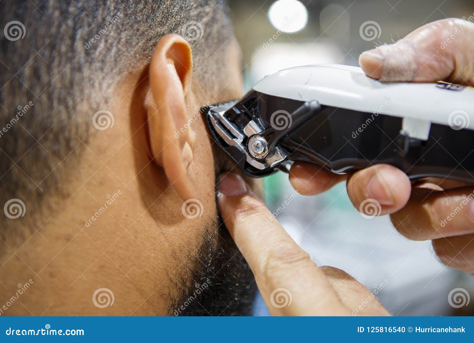 A Barber is Going through the Electric Cutting and Shaving Machine for the  Beard of an African-American Brazilian Boy Stock Image - Image of beauty,  business: 214303807