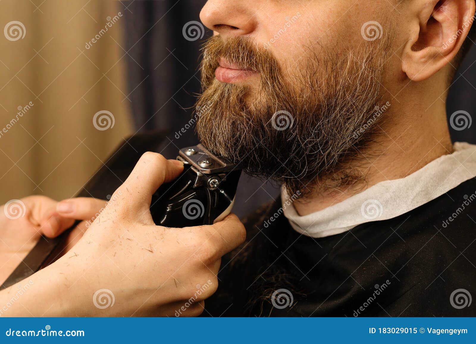 trimming beard with electric razor