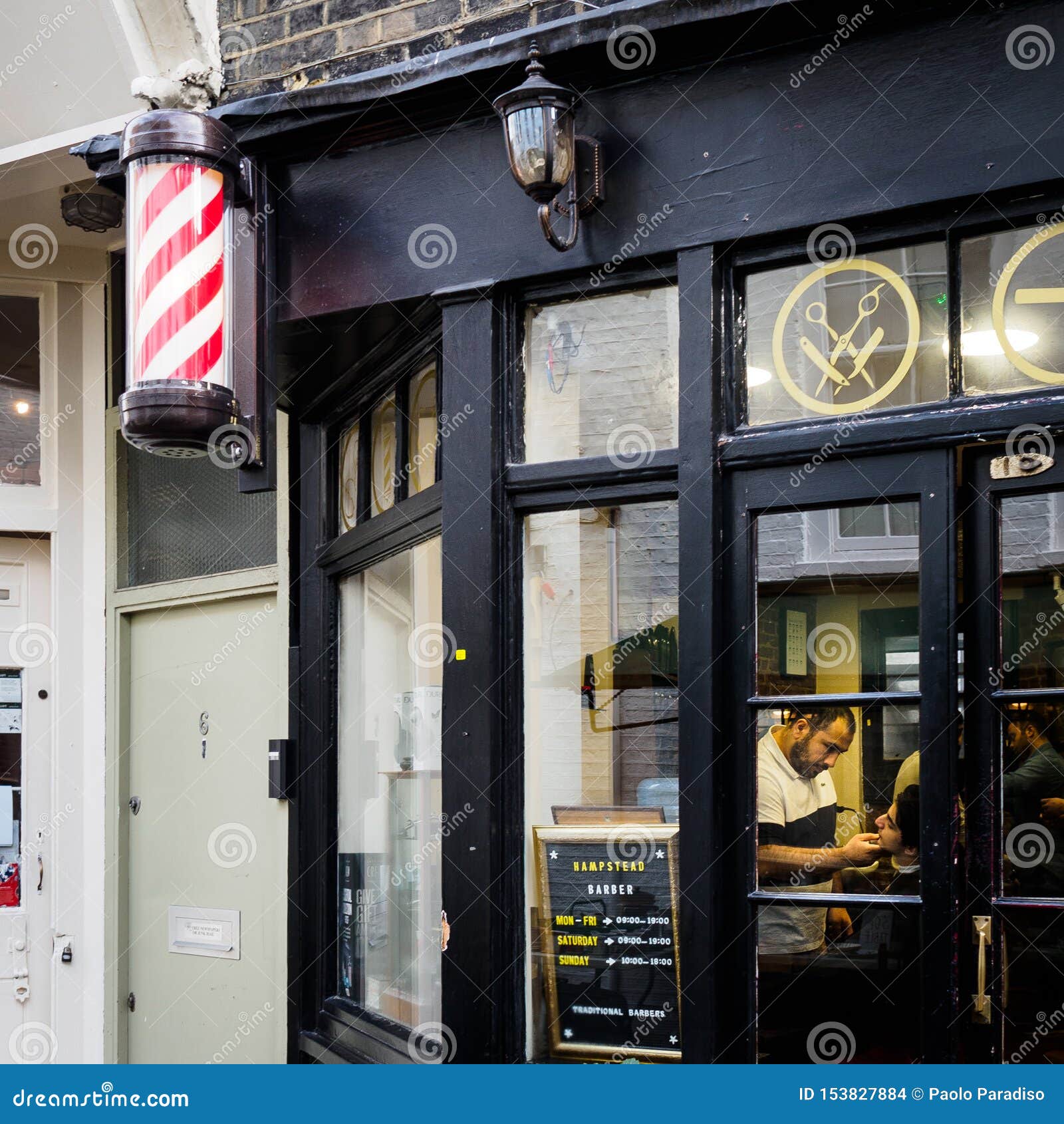 Barber Working in a Barber Shop. London 2017 Editorial Stock Image