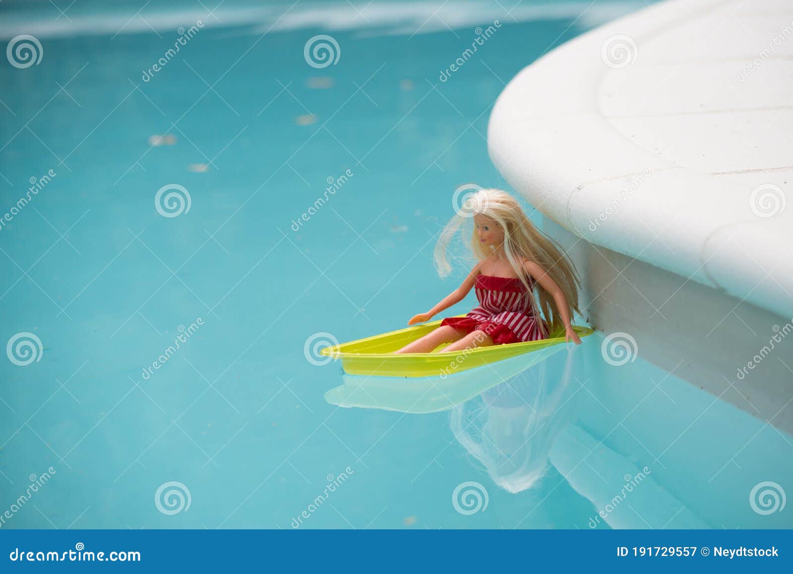 barbie doll in swimming pool