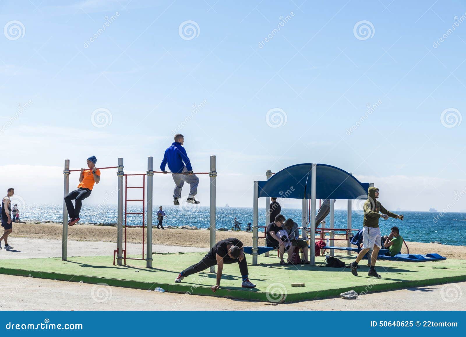 Barcelona, Spain - April 7, 2014: People making sport at Barceloneta Beach in Barcelona, Spain on April 7, 2014