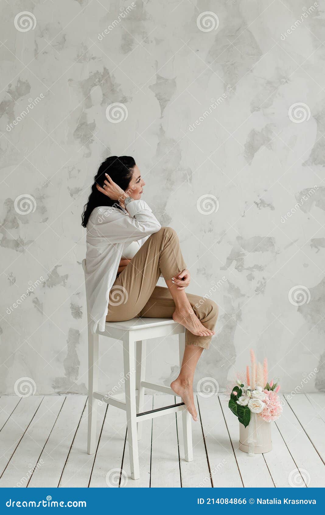 Girl Sitting on Giant Chair Stock Image - Image of barefeet