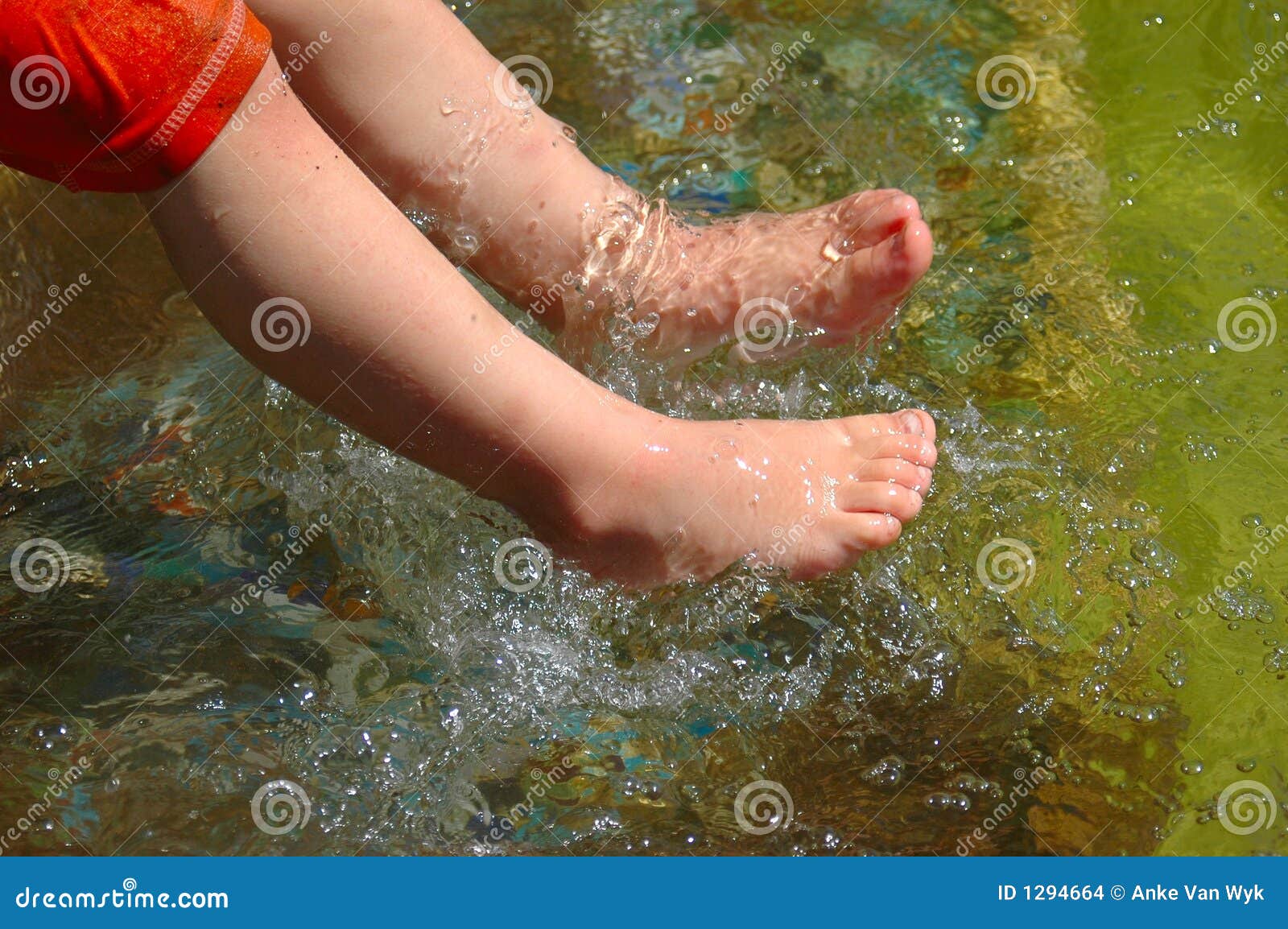 Toddlers Bare Feet, Female Hands Knead Child's Legs, Sensory Experience