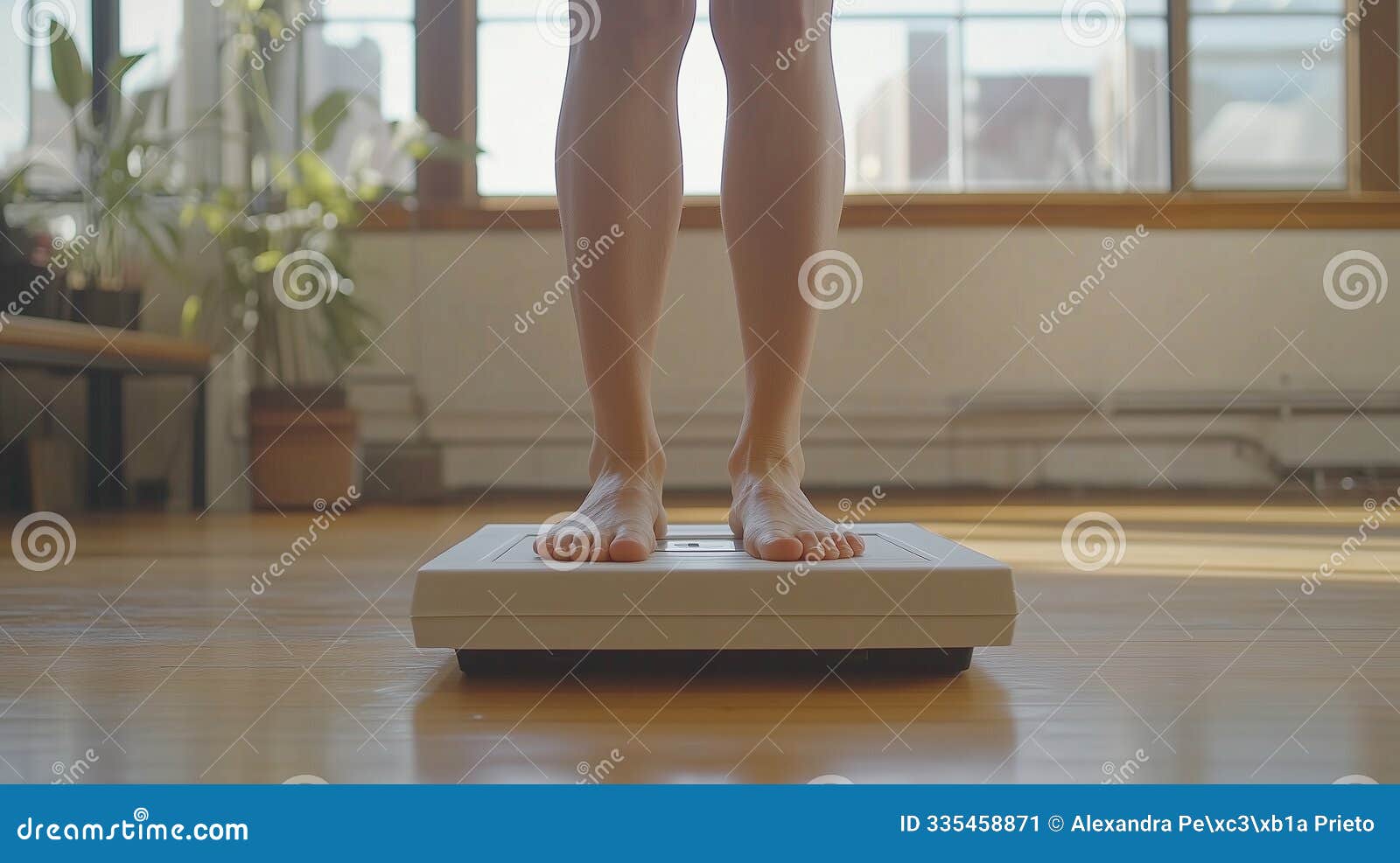 bare feet standing on a scale in a bright room
